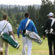 men carying golf bags