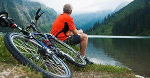 biker sits down on mountain