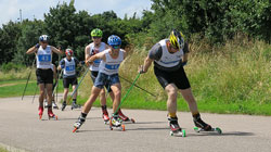 roller skiing men on the road