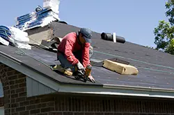 Roofers at work with special footwear