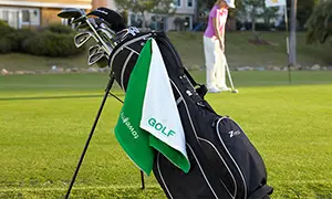 golf towel hanging from golf bag