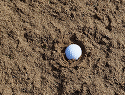 golf ball in sand