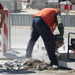 Worker walking on concrete