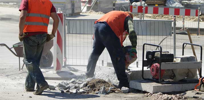 Worker walking on concrete