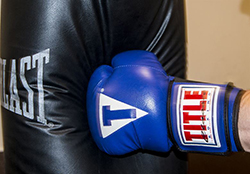 punching a dent in the filler of a heavy bag