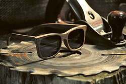 wooden frame sunglass on carved tree