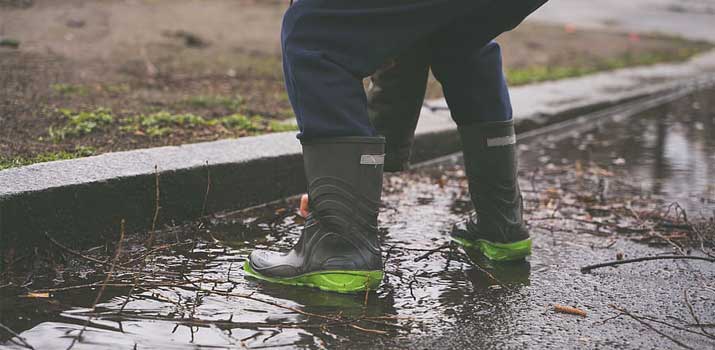 Farm worker wearing proper boots