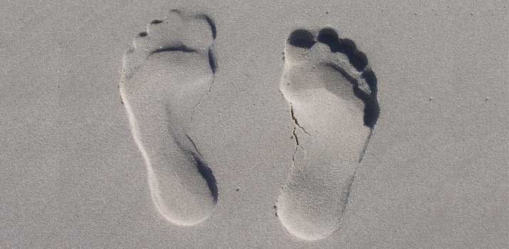 Flat feet print in sand